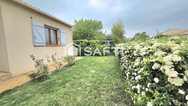Maison de 125 m2, 4 chambres, 2 salles de bain, jardin et garage.