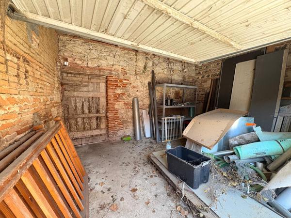 garage et terrain en zone urbaine