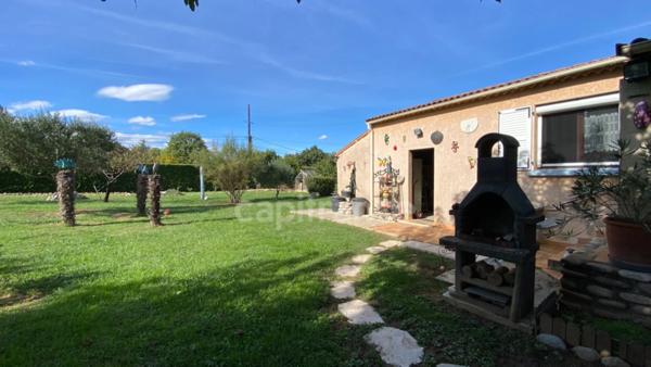 Maison plain-pied avec terrain de 1348 m² et garage à Ruoms (07120)