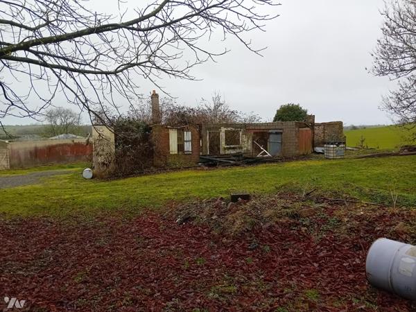 Terrain édifié d'un bâti sinistré.