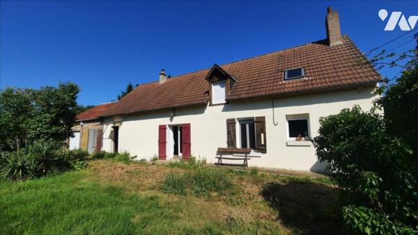 Maison avec parc et petit plan d'eau