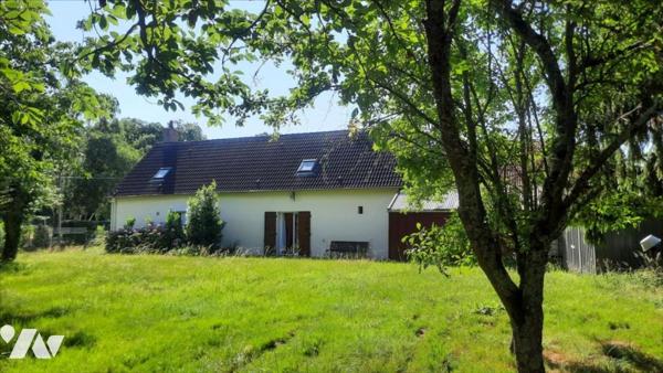 Maison avec parc et petit plan d'eau