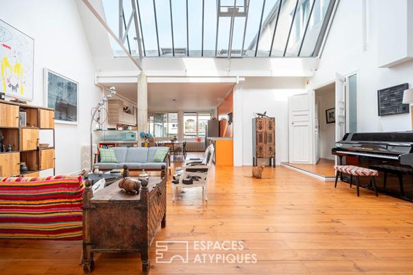 Loft traversant avec verrières zénithales