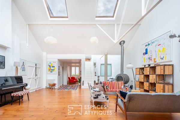 Loft traversant avec verrières zénithales