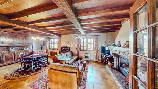 Située à Viodos-Abense-de-Bas à seulement 4mn de Mauléon, découvrez
cette charmante bâtisse Basque de 231m² habitable sur 3 niveaux édifiée 
sur une parcelle plate de 948m².

                - VISITE VIRTUELLE GRATUITE - SUR DEMANDE -

IMPORTANT : Possibilité d'acquérir en plus la parcelle constructible limitrophe de 959m².

Le RDC vous offre une belle entrée, une cuisine séparée de 26m² en accès 
direct sur une grande terrasse de 30m² en exposition Sud-Ouest, un séjour
avec sa cheminée, 3 chambres et une salle de bain.

À l'étage vous bénéficiez de 4 chambres, d'une cuisine séparée, d'une salle de bain +
douche, d'un WC ainsi que d'une belle pièce de 29m² pouvant servir de salon/
salle à manger ou salle de jeux.

Le sous-sol total de 159m² environ avec une double entrée, équipé également d'une cuisine 
et d'une douche, vous permettra de l'utiliser à votre guise (stationnement pour vos voitures, 
rangement, salle de jeux etc...).

Côté extérieur : Beau jardin plat et arboré entièrement clôturé, 2 terrasses, puits alimentant les WC
et machine à laver.

Côté technique : Assainissement collectif, chauffage au gaz, électricité et cheminée, 
production d'eau chaude par cumulus, huisserie bois, double ou survitrage.
Possibilité de raccordement à la fibre.

Les Plus : Secteur calme - Vue dégagée - Sous-sol pouvant servir à une activité artisanale 

Avec une remise au goût du jour intérieur, cette maison érigée avec des matériaux 
de qualité sera parfaite pour une belle vie de famille !

Je suis à votre écoute 7jours/7, je m'adapte à votre planning.