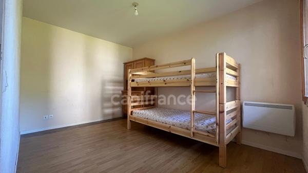 A vendre : Appartement 2 pièces de 36m2 avec balcon et cave dans un cadre d'exception en plein coeur de MANIGOD (74) - Vue montagnes