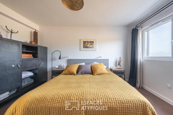 Maison en ossature bois harmonieusement intégrée à la nature