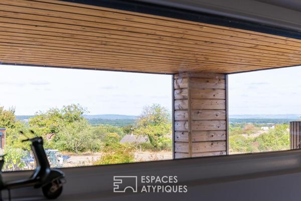 Maison en ossature bois harmonieusement intégrée à la nature