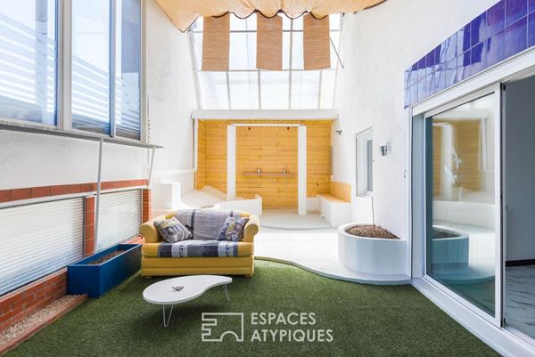 Loft de style industriel et son atrium lumineux