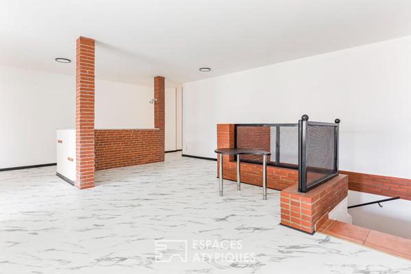 Loft de style industriel et son atrium lumineux