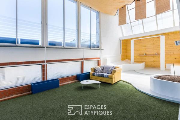 Loft de style industriel et son atrium lumineux