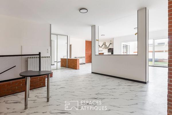 Loft de style industriel et son atrium lumineux