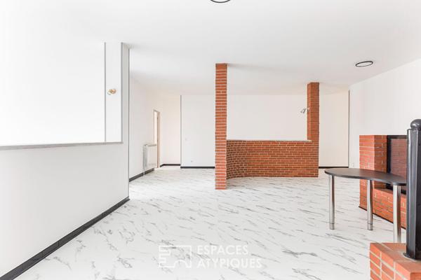 Loft de style industriel et son atrium lumineux