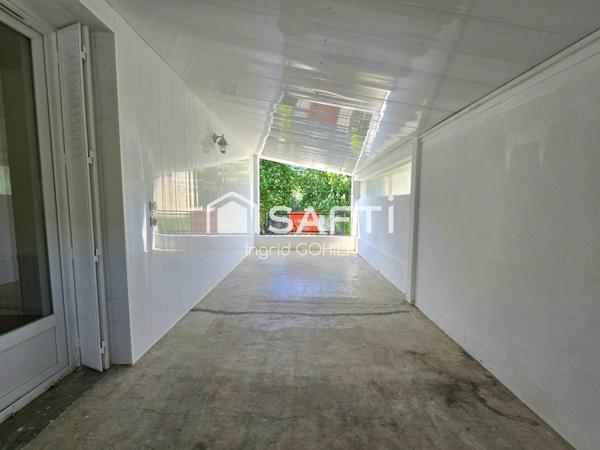 Idéalement située, proche commodités avec jardin et garage