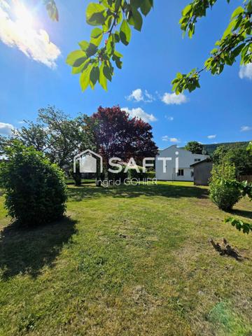 Idéalement située, proche commodités avec jardin et garage