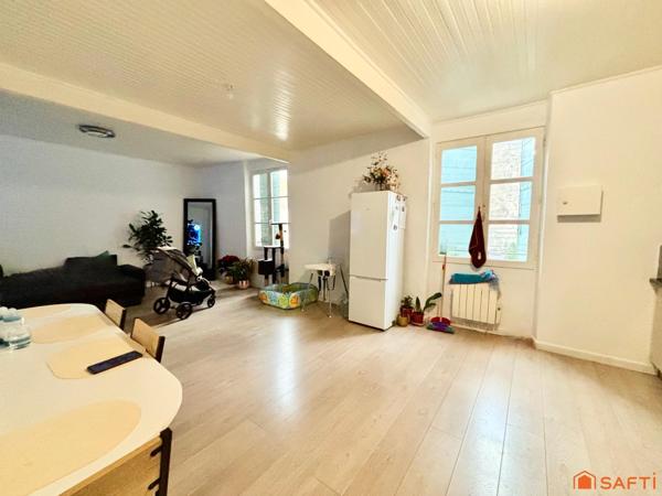 IMMEUBLE LOCATIF: APPARTEMENTS ET GARAGES!