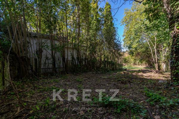 Propriété sur un terrain constructible de 3.500m² en coeur de ville