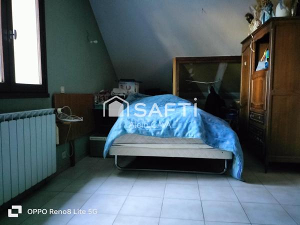 Maison de 238m² surface au sol( 124m² loi carrez )avec terrasse, garage de 89m², sur 2585m² de terrain