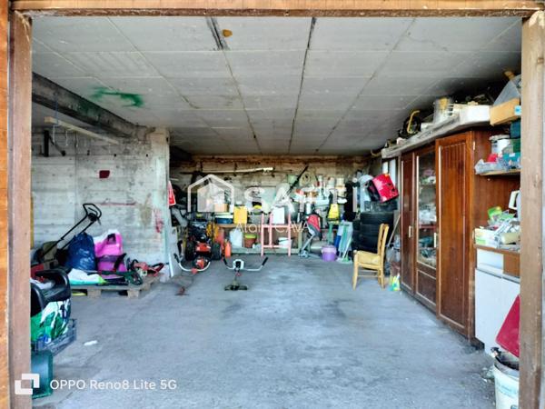 Maison de 238m² surface au sol( 124m² loi carrez )avec terrasse, garage de 89m², sur 2585m² de terrain