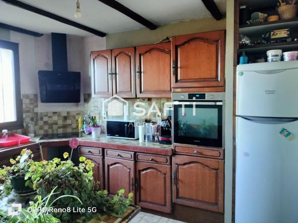 Maison de 238m² surface au sol( 124m² loi carrez )avec terrasse, garage de 89m², sur 2585m² de terrain