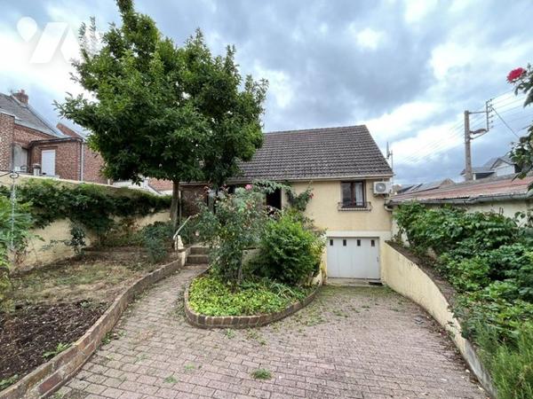 Maison : cuisine séjour, 2 ch, mezzanine, cave, véranda, garage.