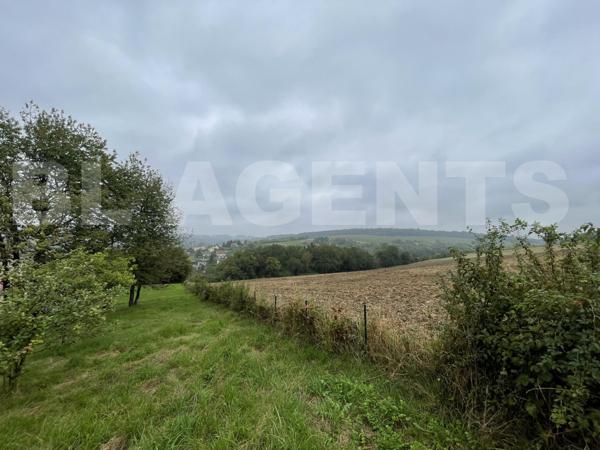 BEAU TERRAIN AVEC VUE DEGAGEE GRANDE FACADE