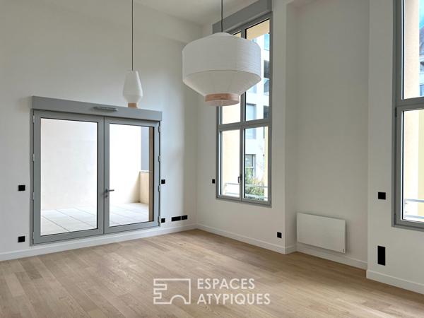 T3 duplex lumineux au style loft dans un lieu emblématique