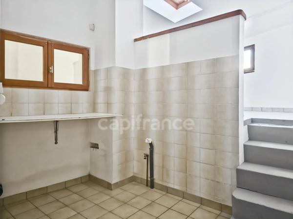 Immeuble de rapport au Grand-Lucé comprenant un local commercial et un appartement