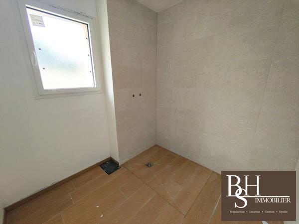 NEUF - Appartement 3 pièces d'environ 59m² avec terrasse, jardinet et parking dans résidence sécurisée