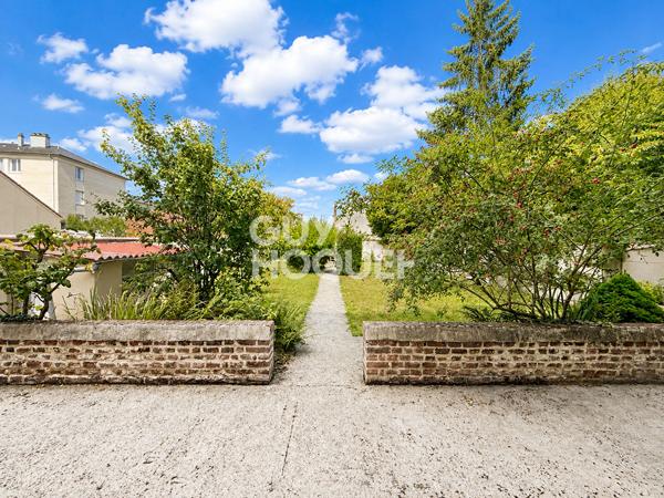 Maison proche centre ville avec jardin