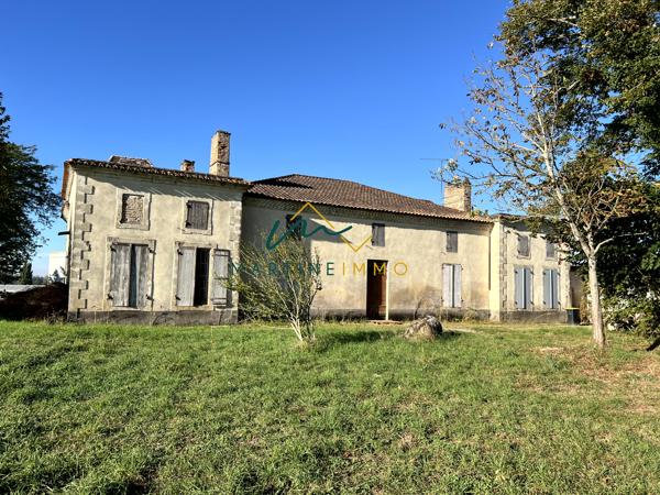 A VENDRE TERRAIN COMMERCIAL AVEC MAISON A FAUILLET