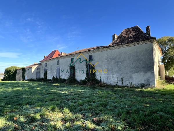 A VENDRE TERRAIN COMMERCIAL AVEC MAISON A FAUILLET