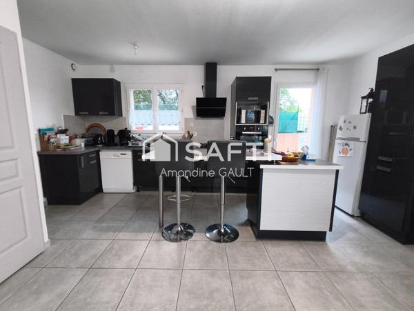 Maison avec jardin associant performance et charme prêts à vivre !