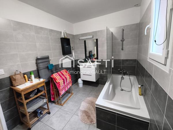 Maison avec jardin associant performance et charme prêts à vivre !