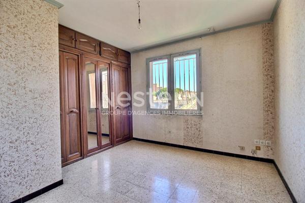 Marignane- Appartement 3/4 pièces d'une surface de 78 m² avec une véranda et un jardin.