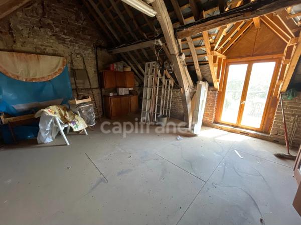 Maison 1 chambre, grenier aménageable, grand garage.
