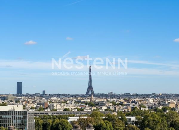 Appartement Courbevoie 3 pièces 70 m2 vue Paris et Tour Eiffel bonne exposition balcons étage élevé traversant proche commodités écoles transports