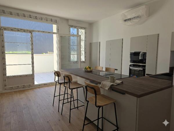 Appartement entièrement rénové avec terrasse et parking