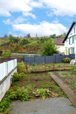 Maison F4 avec terrasses, sous-sol, garage et jardin