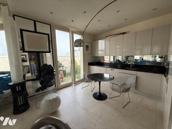 VENTE EN VIAGER APPARTEMENT HYPER CENTRE DINARD VUE MER JARDIN PRIVATIF PLACE DE PARKING EN SOUS SOL