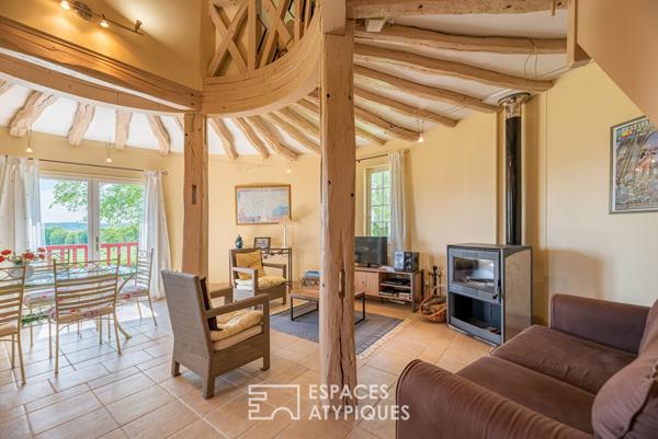 Ancien moulin meublé dans un environnement verdoyant