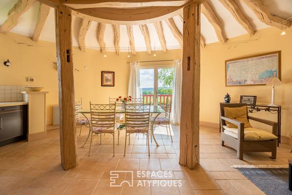 Ancien moulin meublé dans un environnement verdoyant