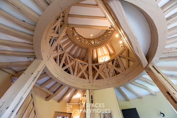 Ancien moulin meublé dans un environnement verdoyant