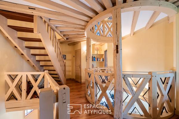 Ancien moulin meublé dans un environnement verdoyant