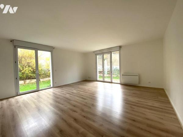 Appartement 5 pièces avec jardin, garage et cave.