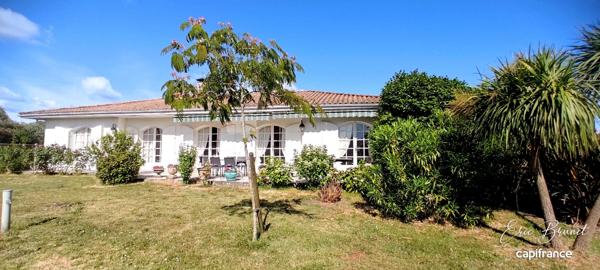 Charmante maison de plain-pied 4 chambres sur beau terrain arboré de 1 450 m²