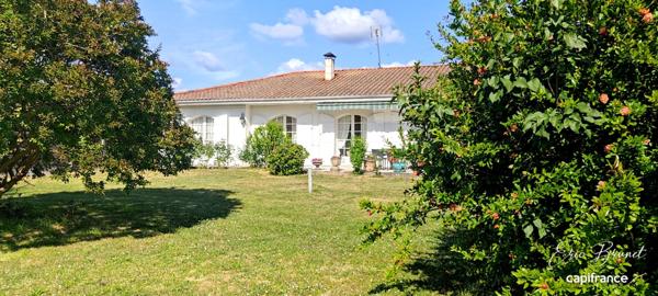Charmante maison de plain-pied 4 chambres sur beau terrain arboré de 1 450 m²
