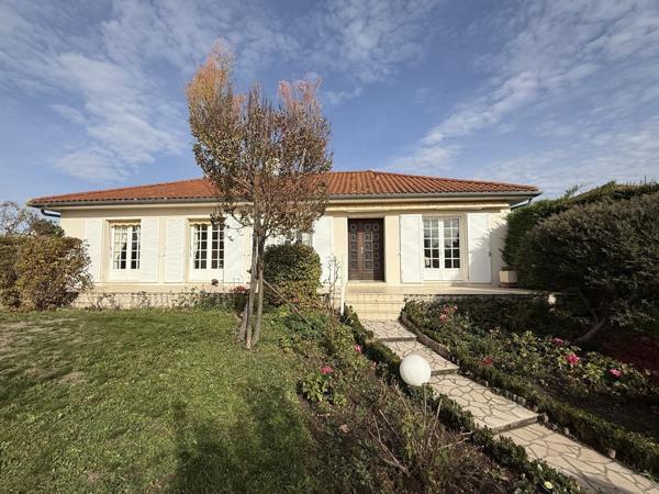 Maison avec garage et sous-sol complet + jardin