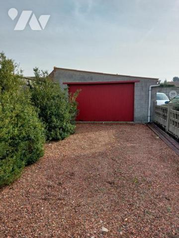 Maison de ville avec 3 chambres garage et grand jardin.