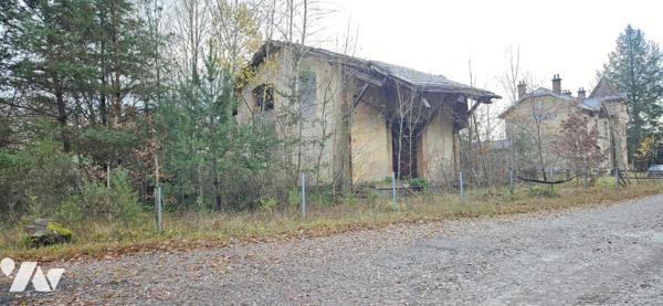 Entrepôt avec terrain constructible 